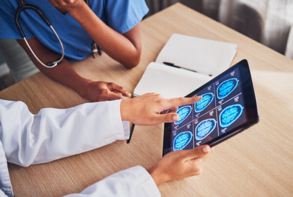 Doctor and nurse reviewing MRI scan.